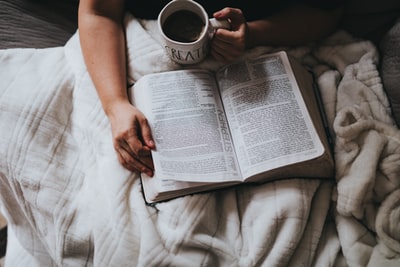 Reading with a cup
